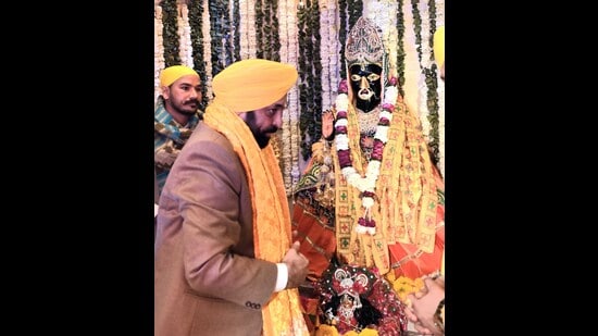 Punjab chief minister Bhagwant Mann praying for peace, progress and prosperity of people at Baglamukhi Dham in Pakhowal, Ludhiana, on Saturday. (HT Photo)