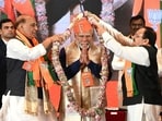 Prime Minister Narendra Modi with defence minister Rajnath Singh and BJP president JP Nadda at Bharat Mandapam on February 17. Prime Minister Narendra Modi with defence minister Rajnath Singh and BJP president JP Nadda at Bharat Mandapam on February 17.