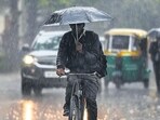 Commuter riding a bicycle amid light rain in Delhi NCR. Commuter riding a bicycle amid light rain in Delhi NCR.