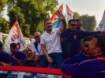 Prayagraj: Congress leader Rahul Gandhi with others greets supporters at a roadshow. 