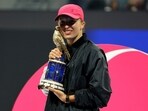 Poland's Iga Swiatek poses with the trophy after winning the final against Kazakhstan's Elena Rybakina