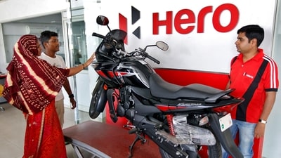 Customers look at a Hero MotoCorp Karizma motorbike at a Hero MotoCorp showroom in the western Indian city of Ahmedabad (Reuters file)