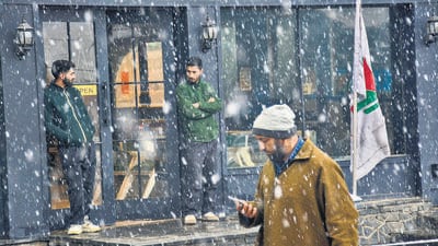 Residents taking shelter during snowfall at Tangmarg, in Baramulla district, Jammu and Kashmir. (PTI) Residents taking shelter during snowfall at Tangmarg, in Baramulla district, Jammu and Kashmir. (PTI)