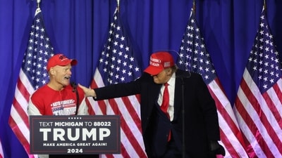 Former US President and 2024 presidential hopeful Donald Trump greets retired auto worker Brian Pannebeckerat during a "Get Out the Vote" rally in Waterford Township, Michigan, on February 17, 2024. The state�s primary election is set to take place on February 27. (Photo by alex wroblewski / AFP) (AFP) Former US President and 2024 presidential hopeful Donald Trump greets retired auto worker Brian Pannebeckerat during a "Get Out the Vote" rally in Waterford Township, Michigan, on February 17, 2024. The state�s primary election is set to take place on February 27. (Photo by alex wroblewski / AFP) (AFP)