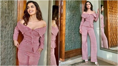 Manushi wore a red and white printed blouse and pants set. While the top features an off-the-shoulder neckline, full-length sleeves, overturned collars, front button closures, and a figure-hugging silhouette, the pants have a high-rise waist and a flared silhouette. (Instagram) Manushi wore a red and white printed blouse and pants set. While the top features an off-the-shoulder neckline, full-length sleeves, overturned collars, front button closures, and a figure-hugging silhouette, the pants have a high-rise waist and a flared silhouette. (Instagram)
