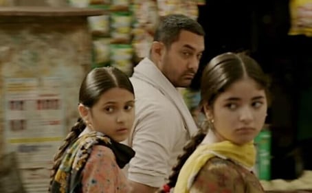 Suhani Bhatnagar in a still with Aamir Khan and Zaira Wasim from Dangal. Suhani Bhatnagar in a still with Aamir Khan and Zaira Wasim from Dangal.