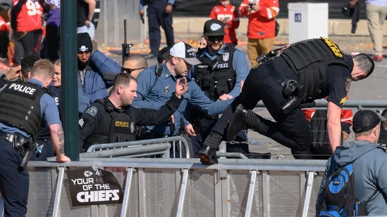 Law enforcement personnel clear the area around Union Station following a shooting at the Kansas City Chiefs NFL football Super Bowl celebration in Kansas City, Mo., Wednesday, Feb. 14, 2024. (AP Photo/Reed Hoffmann, File) (AP)
