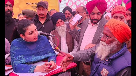 Punjab tourism and cultural affairs minister Anmol Gagan Maan interacting with residents at the public camps held in Kurali. (HT PHOTO)