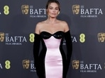 Margot Robbie dons a strapless pink and black gown from Armani Privé at BAFTA 2024