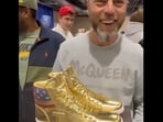 Luxury Bazaar founder and CEO, Roman Sharf, showed off the personally signed Donald Trump sneakers at Sneaker Con after winning the bidding.