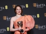 Emma Stone, winner of the leading actress award for 'Poor Things', poses for photographers at the 77th British Academy Film Awards, BAFTA's, in London, Sunday, Feb. 18, 2024. (Photo by Vianney Le Caer/Invision/AP)