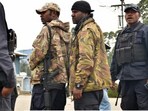 Police preparing to go on patrol outside their police station in the town of Wabag in the highlands province of Enga. Police preparing to go on patrol outside their police station in the town of Wabag in the highlands province of Enga.