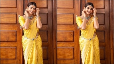 Pooja accessorised her stunning look with traditional jewellery including a diamond choker necklace studded with a green emerald, a luxurious multi-layered chain necklace, matching statement earrings, a silver mang tikka, stacked bangles adorning her wrist and an enchanting waistband that perfectly complemented her look. (Instagram/@hegdepooja) Pooja accessorised her stunning look with traditional jewellery including a diamond choker necklace studded with a green emerald, a luxurious multi-layered chain necklace, matching statement earrings, a silver mang tikka, stacked bangles adorning her wrist and an enchanting waistband that perfectly complemented her look. (Instagram/@hegdepooja)