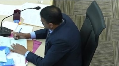 Chandigarh mayoral elections: A screengrab of the video shared by AAP on X allegedly shows returning officer Anil Masih marking 'X' on ballot papers. Chandigarh mayoral elections: A screengrab of the video shared by AAP on X allegedly shows returning officer Anil Masih marking 'X' on ballot papers.