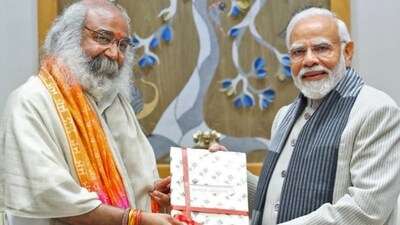 Acharya Pramod with Prime Minister Narendra Modi (ANI) Acharya Pramod with Prime Minister Narendra Modi (ANI)