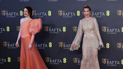 Emma Stone and Emily Blunt pose at the red carpet. Emma won Best Actress for Poor Things but Emily lost Best Supporting Actress to Da'Vine Joy Randolph. (REUTERS)
