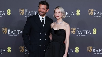 Bradley Cooper and Carey Mulligan pose at the 2024 British Academy of Film and Television Awards (BAFTA) at the Royal Festival Hall in the Southbank Centre. While Bradley wore a black trench, pants and white shirt from Louis Vuitton, Carey complemented him in a strapless floor-length ballgown.&nbsp; (REUTERS)