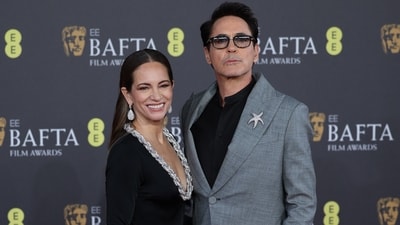 Robert Downey Jr attended the 2024 BAFTA Awards with his wife Susan. The star lit up the red carpet in a grey suit, black shirt, matching pants, and a starfish-shaped brooch. His signature sunglasses, a clean-shaven look, and a side-parted hairdo rounded it off.&nbsp; (REUTERS)