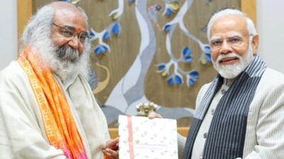 Acharya Pramod Krishnam with Prime Minister Narendra Modi. (X/SurendraPoonia) Acharya Pramod Krishnam with Prime Minister Narendra Modi. (X/SurendraPoonia)