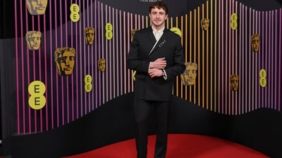 Paul Mescal turned heads on the red carpet in a black tailored suit from Gucci and jewels from Cartier. He paired the double-breasted blazer and straight-fit pants with a white button-down, a tie, a messy hairdo, and a trimmed beard. (Vianney Le Caer/Invision/AP) Paul Mescal turned heads on the red carpet in a black tailored suit from Gucci and jewels from Cartier. He paired the double-breasted blazer and straight-fit pants with a white button-down, a tie, a messy hairdo, and a trimmed beard. (Vianney Le Caer/Invision/AP)