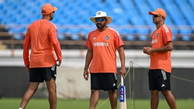 Rohit Sharma (C), coach Rahul Dravid (R) and bowling coach Paras Mhambrey interact during a practice session (AFP) Rohit Sharma (C), coach Rahul Dravid (R) and bowling coach Paras Mhambrey interact during a practice session (AFP)
