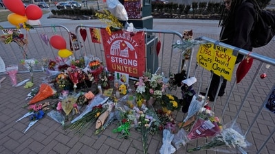 A person views a memorial dedicated to the victims of last week's mass shooting in front of Union Station, Sunday, Feb. 18, 2024, in Kansas City, Mo. Authorities say two juveniles have been charged with crimes connected to the shooting at the Kansas City Chiefs’ Super Bowl rally. (AP Photo/Charlie Riedel) (AP) A person views a memorial dedicated to the victims of last week's mass shooting in front of Union Station, Sunday, Feb. 18, 2024, in Kansas City, Mo. Authorities say two juveniles have been charged with crimes connected to the shooting at the Kansas City Chiefs’ Super Bowl rally. (AP Photo/Charlie Riedel) (AP)