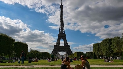 Strike at the Eiffel Tower closes one of the world's most popular monuments to visitors. (Photo by MIGUEL MEDINA / AFP) Strike at the Eiffel Tower closes one of the world's most popular monuments to visitors. (Photo by MIGUEL MEDINA / AFP)