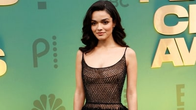Rachel Zegler walked the red carpet in a beauteous black gown featuring a sheer bodice adorned in shimmering diamantes and a layered skirt decked in sequinned tassels. She paired the dress with black pumps, rings, earrings, side-parted open tresses, and minimal glam picks. (AFP) Rachel Zegler walked the red carpet in a beauteous black gown featuring a sheer bodice adorned in shimmering diamantes and a layered skirt decked in sequinned tassels. She paired the dress with black pumps, rings, earrings, side-parted open tresses, and minimal glam picks. (AFP)