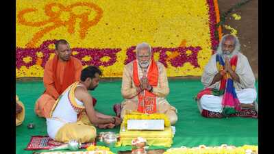 Prime Minister Narendra Modi performing pooja during the foundation stone laying ceremony of Shri Kalki Dham temple in Sambhal district on Monday. Uttar Pradesh CM Yogi Adityanath and Shri Kalki Dham Nirman Trust chairman Acharya Pramod Krishnam also present. (HT PHOTO) Prime Minister Narendra Modi performing pooja during the foundation stone laying ceremony of Shri Kalki Dham temple in Sambhal district on Monday. Uttar Pradesh CM Yogi Adityanath and Shri Kalki Dham Nirman Trust chairman Acharya Pramod Krishnam also present. (HT PHOTO)