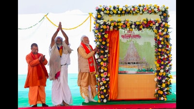 Prime Minister Narendra Modi with chief minister Yogi Adityanath and Acharya Pramod Krishnan during foundation stone laying ceremony of Shri Kalki Dham at Anchora Kamboh in Sambhal on Monday. (HT PHOTO) Prime Minister Narendra Modi with chief minister Yogi Adityanath and Acharya Pramod Krishnan during foundation stone laying ceremony of Shri Kalki Dham at Anchora Kamboh in Sambhal on Monday. (HT PHOTO)