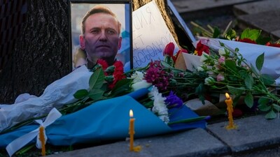 A portrait of opposition leader Alexei Navalny and flowers are seen during a protest in front of Russian embassy in Belgrade, Serbia. (AP) A portrait of opposition leader Alexei Navalny and flowers are seen during a protest in front of Russian embassy in Belgrade, Serbia. (AP)