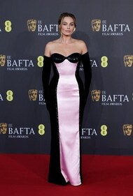 Margot Robbie dons a strapless pink and black gown from Armani Privé at BAFTA 2024 (Photo: Reuters) Margot Robbie dons a strapless pink and black gown from Armani Privé at BAFTA 2024 (Photo: Reuters)