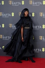 Naomi Campbell donned a black layered, ruffled A-line dress from Chanel’s fall/winter 2023 Couture collection at BAFTA 2024 (Photo: Reuters) Naomi Campbell donned a black layered, ruffled A-line dress from Chanel’s fall/winter 2023 Couture collection at BAFTA 2024 (Photo: Reuters)