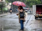 Commuters during light rain in NCR. Commuters during light rain in NCR.
