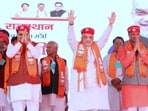 Union home minister Amit Shah with Rajasthan chief minister Bhajan Lal Sharma (left) and state BJP chief CP Joshi at a rally in Udaipur on Tuesday.