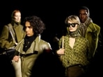 Models present creations at the Burberry catwalk show during London Fashion Week in London, Britain. 