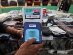 Paytm Share Price: Cutlery vendor switches on Paytm, a digital payments firm, speaker to receive received payment details at a roadside market in Ahmedabad.