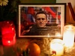 Candles burn as people attend a vigil following the death of Russian opposition leader Alexei Navalny. (Reuters)