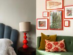 Own a red lamp, rug, or a coffee table that’s waiting for a much-needed paint job? Bring together all the red items and find a place where they can stand out.
