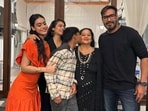 Nysa Devgan, Kajol, Yug, Veena and Ajay Devgn pose for a photo.