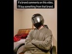 Cameron sitting on a chair sporting a hoodie, trousers and a helmet. Cameron sitting on a chair sporting a hoodie, trousers and a helmet.