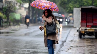 Commuters during light rain in NCR. Commuters during light rain in NCR.