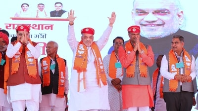 Union home minister Amit Shah with Rajasthan chief minister Bhajan Lal Sharma (left) and state BJP chief CP Joshi at a rally in Udaipur on Tuesday.