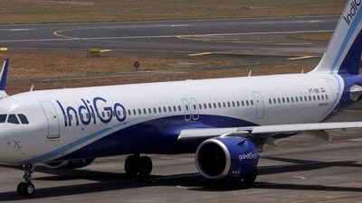 An IndiGo airlines passenger aircraft taxis on the tarmac. An IndiGo airlines passenger aircraft taxis on the tarmac.