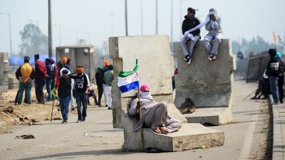 Farmers rest during a protest to demand minimum crop prices, near the Haryana-Punjab state border at Shambhu in Patiala district about 200 kilometres (125 miles) north of New Delhi on February 19, 2024. (AFP)