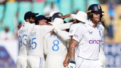 England's captain Ben Stokes, right, leaves the field after losing his wicket (AP)