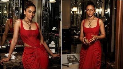 Next on the list, we have the gorgeous Rakul Preet Singh. Her fiery red look in a trendy corset ensemble from Deme is sure to inspire your wardrobe. Her corset blouse features a sleeveless design, wide square neckline, structured boning, corset bodice, an asymmetric hem and a bodycon fit. Rakul paired it with a matching skirt with an asymmetric high-rise waist, a figure-hugging fit, a gathered front design and a floor-length hem. Styled with several quirky gold stacked chain necklaces, she proves her fashion savvy. (Instagram) Next on the list, we have the gorgeous Rakul Preet Singh. Her fiery red look in a trendy corset ensemble from Deme is sure to inspire your wardrobe. Her corset blouse features a sleeveless design, wide square neckline, structured boning, corset bodice, an asymmetric hem and a bodycon fit. Rakul paired it with a matching skirt with an asymmetric high-rise waist, a figure-hugging fit, a gathered front design and a floor-length hem. Styled with several quirky gold stacked chain necklaces, she proves her fashion savvy. (Instagram)