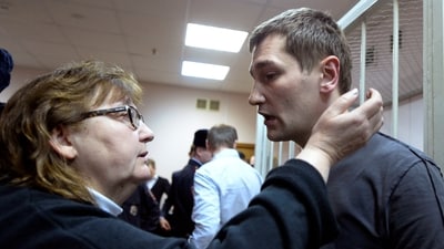 Russian opposition activist and anti-corruption crusader Alexei Navalny's brother Oleg Navalny speaks to his mother Lyudmila, left, at a court in Moscow, Russia, Tuesday, Dec. 30, 2014. (AP) Russian opposition activist and anti-corruption crusader Alexei Navalny's brother Oleg Navalny speaks to his mother Lyudmila, left, at a court in Moscow, Russia, Tuesday, Dec. 30, 2014. (AP)