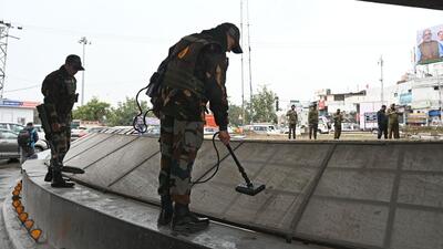 Security personnel carrying out searches outside the Maulana Azad Stadium ahead of Prime Minister Narendra Modi’s visit in Jammu. (Waseem Andrabi/HT)