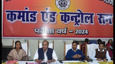 UP Board secretary Dibyakant Shukla (second from left) addressing media persons on February 20. (HT photo)